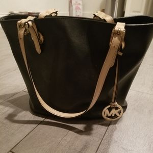 Michael Kors purse black  w/ tan straps